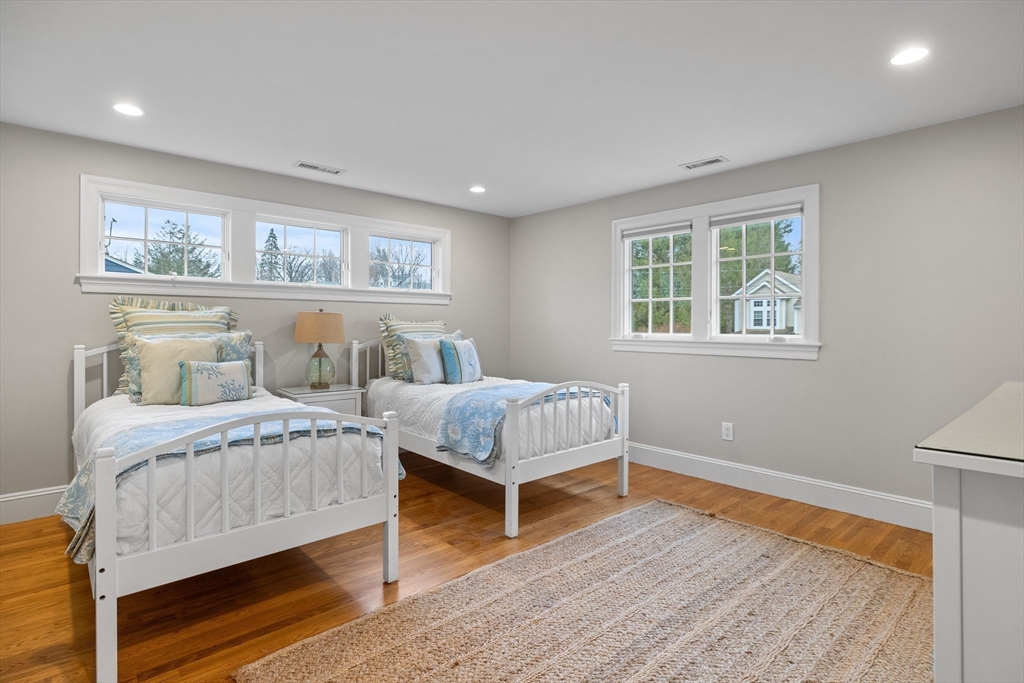 9 Augustus Road Lexington, MA 02421 - Photo 23 of 41 a bedroom with furniture and a wooden floor