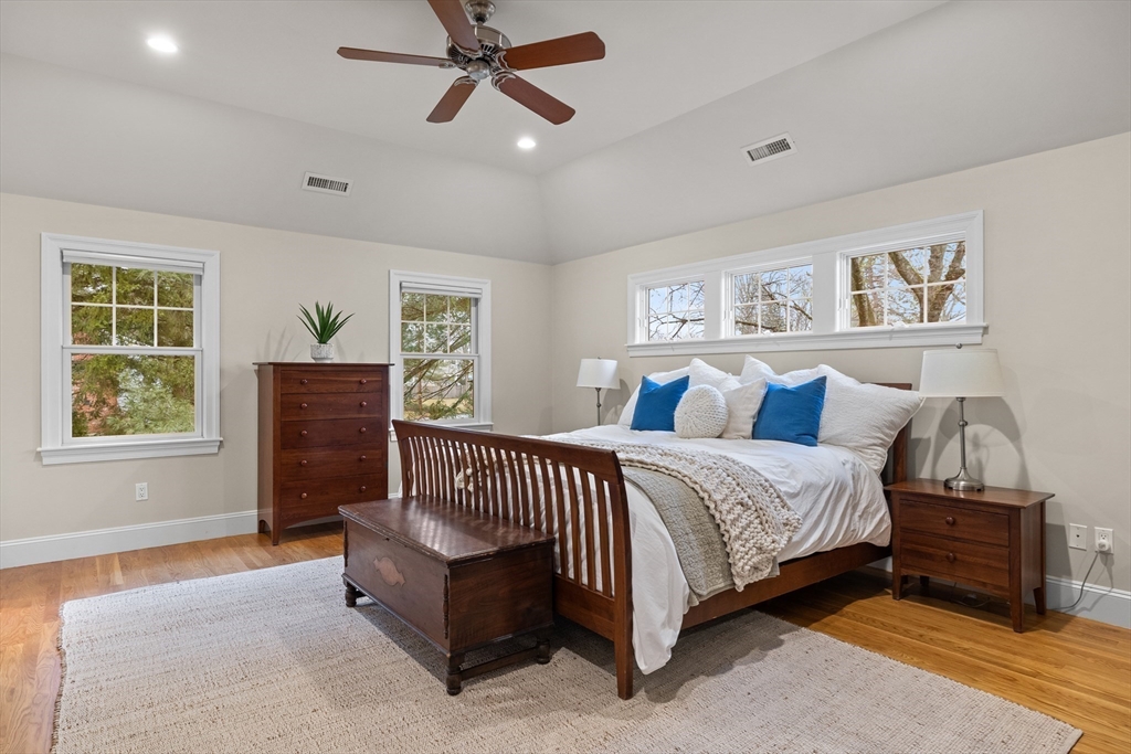 9 Augustus Road Lexington, MA 02421 - Photo 25 of 41 a spacious bedroom with a bed and a couch