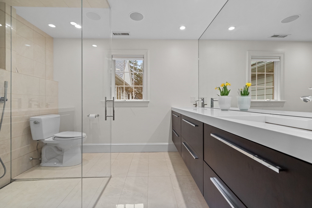 9 Augustus Road Lexington, MA 02421 - Photo 28 of 41 a bathroom with a sink a toilet and shower