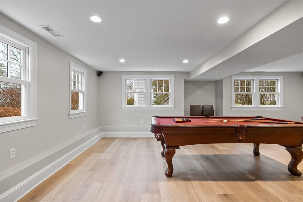 9 Augustus Road Lexington, MA 02421 - Photo 33 of 41 a living room with a table a window and piano table