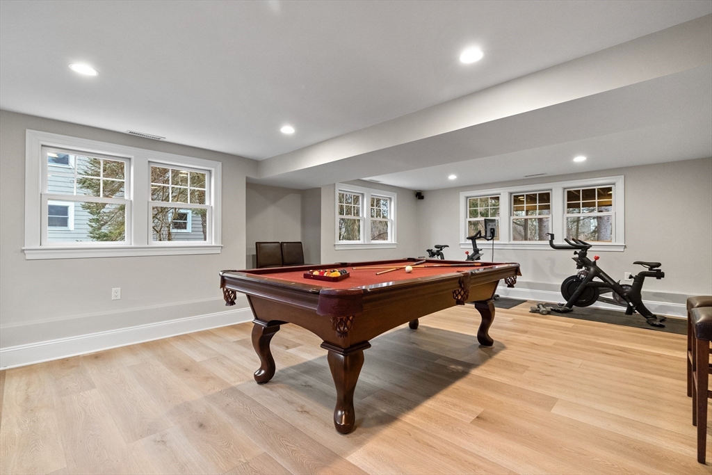 9 Augustus Road Lexington, MA 02421 - Photo 34 of 41 a living room with a table a rug and a window