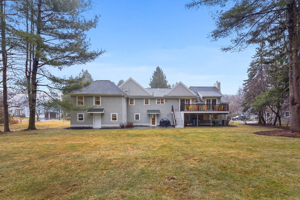 9 Augustus Road Lexington, MA 02421 - Photo 40 of 41 a view of a house with a big yard and large trees