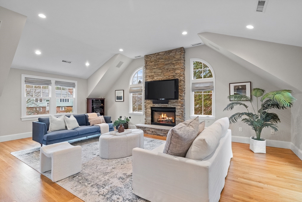 9 Augustus Road Lexington, MA 02421 - Photo 7 of 41 a living room with fireplace furniture and a flat screen tv