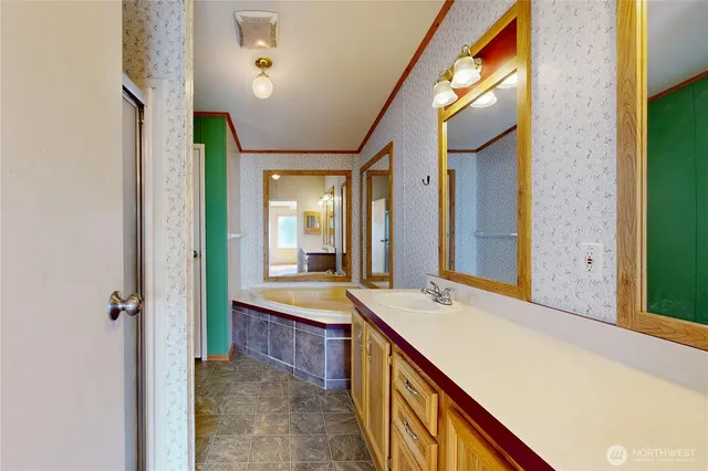a bathroom with a bathtub and a sink