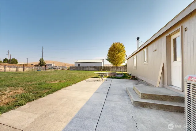 a view of swimming pool with a yard