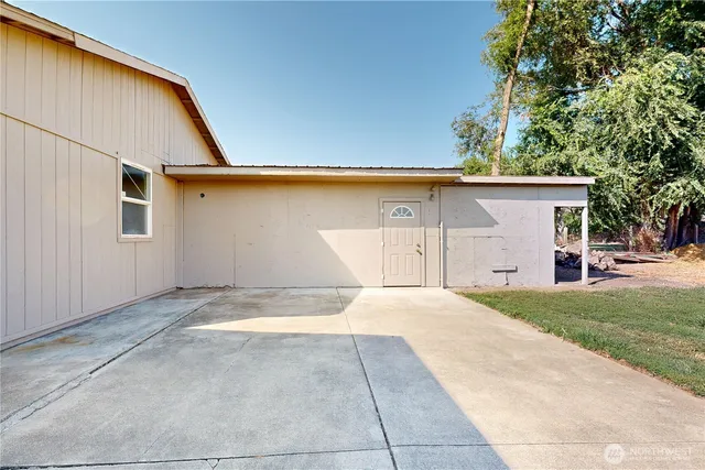 a view of an empty room with a iron stairs