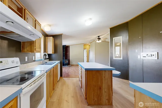 a kitchen with a stove and a refrigerator