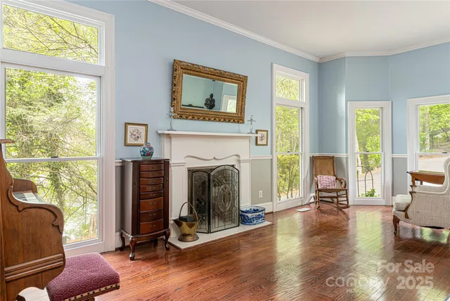 a view of a livingroom with furniture a fireplace