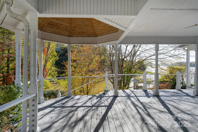 front view of house with a chairs and table in a patio