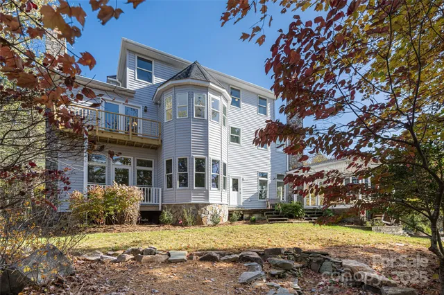 a balcony view with a outdoor seating