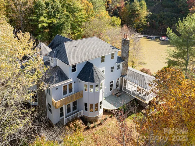 a view of a house with roof deck front of house