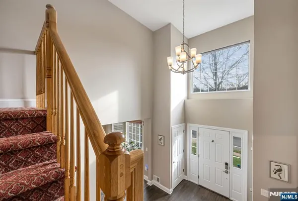 a view of a livingroom with furniture and stairs