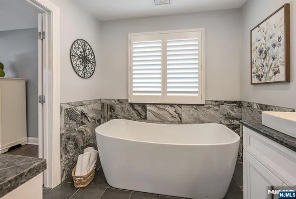 a white bath tub sitting in a bathroom