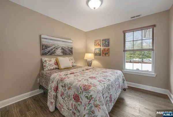 a bedroom with bed and window