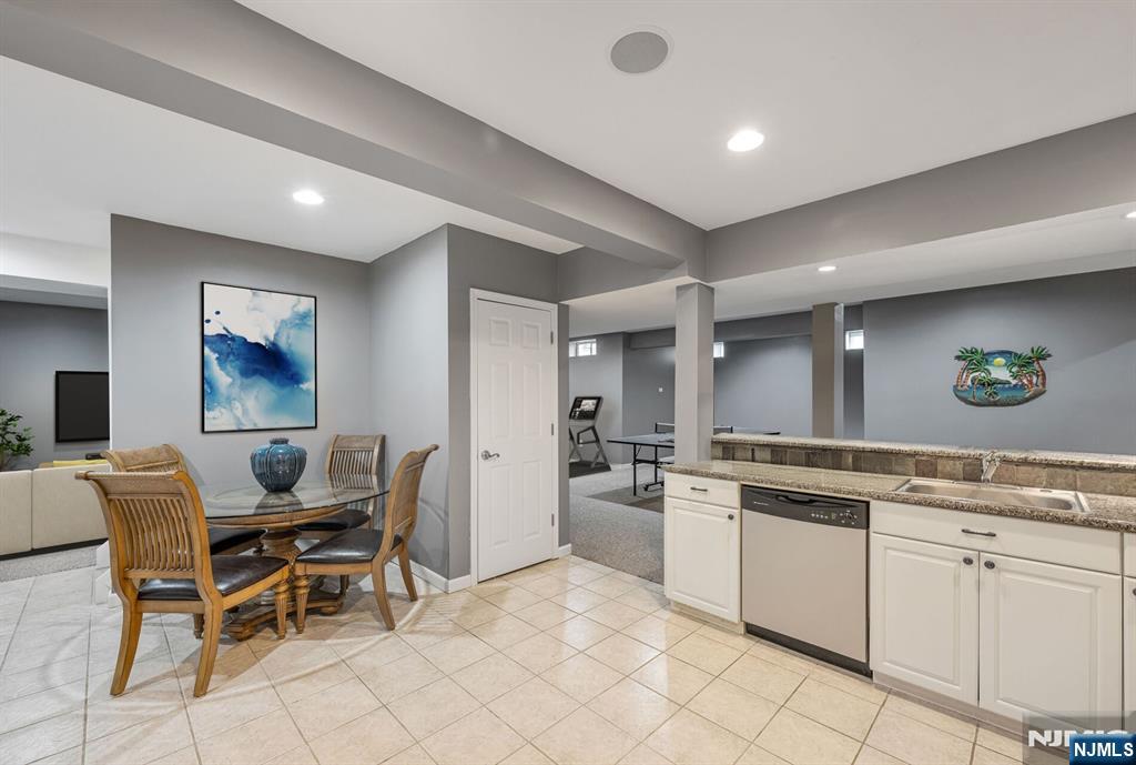 7 Winding Ridge Road Lake Hopatcong, NJ 07849 - Photo 38 of 48 a kitchen with white cabinets and white appliances