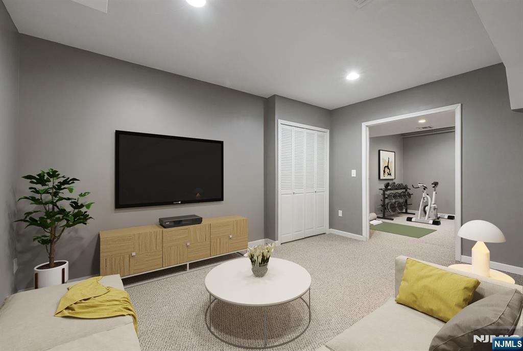 7 Winding Ridge Road Lake Hopatcong, NJ 07849 - Photo 42 of 48 a living room with furniture and a flat screen tv