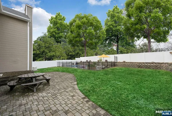 a view of swimming pool with outdoor seating