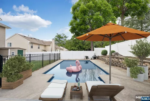 a backyard of a house with barbeque oven