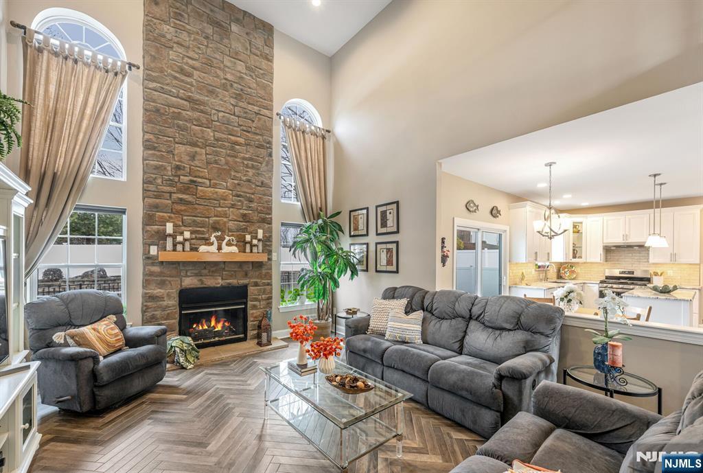 7 Winding Ridge Road Lake Hopatcong, NJ 07849 - Photo 9 of 48 a living room with furniture fireplace and a large window