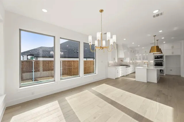 a view of a big room with windows