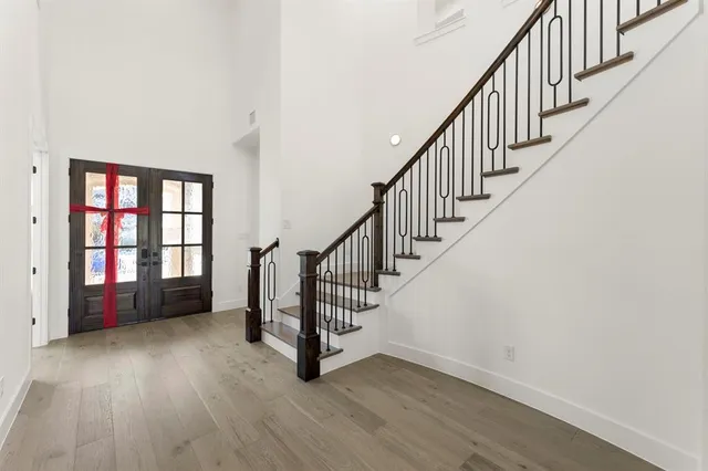 a view of an entryway with wooden floor