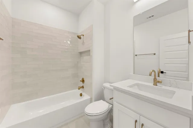 a bathroom with a sink a toilet and a bathtub