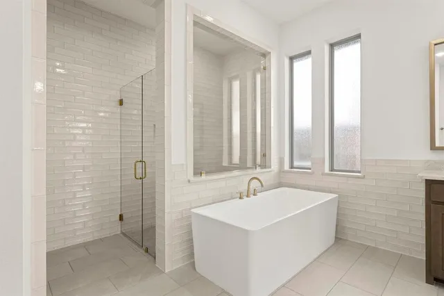 a bathroom with a sink a mirror and a bathtub