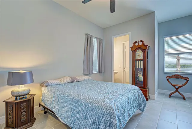 a bedroom with a bed and dresser