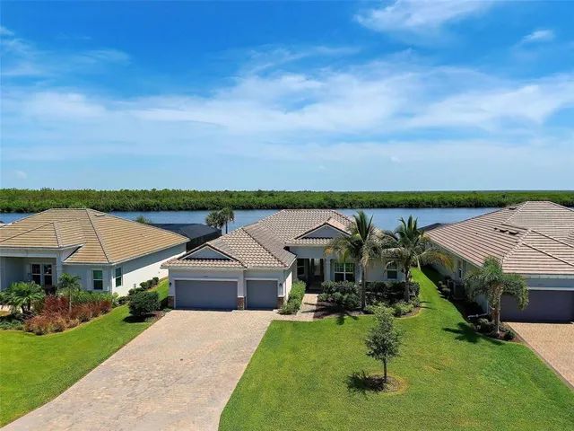 an aerial view of a house with garden space and a view of house