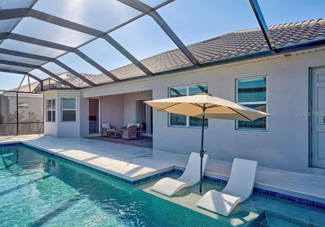 a patio with a table and chairs