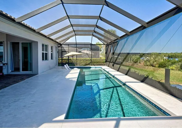a view of a backyard with sitting area