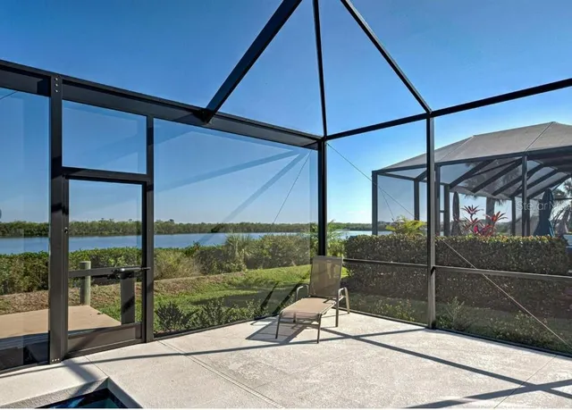 a view of a swimming pool with a patio