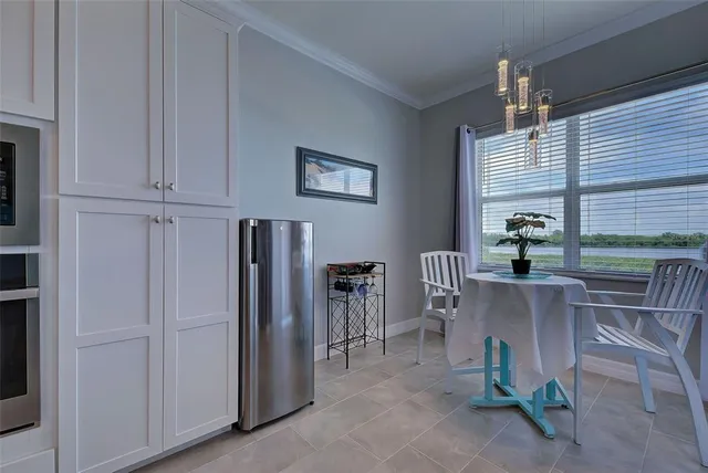 a dining room with furniture and window