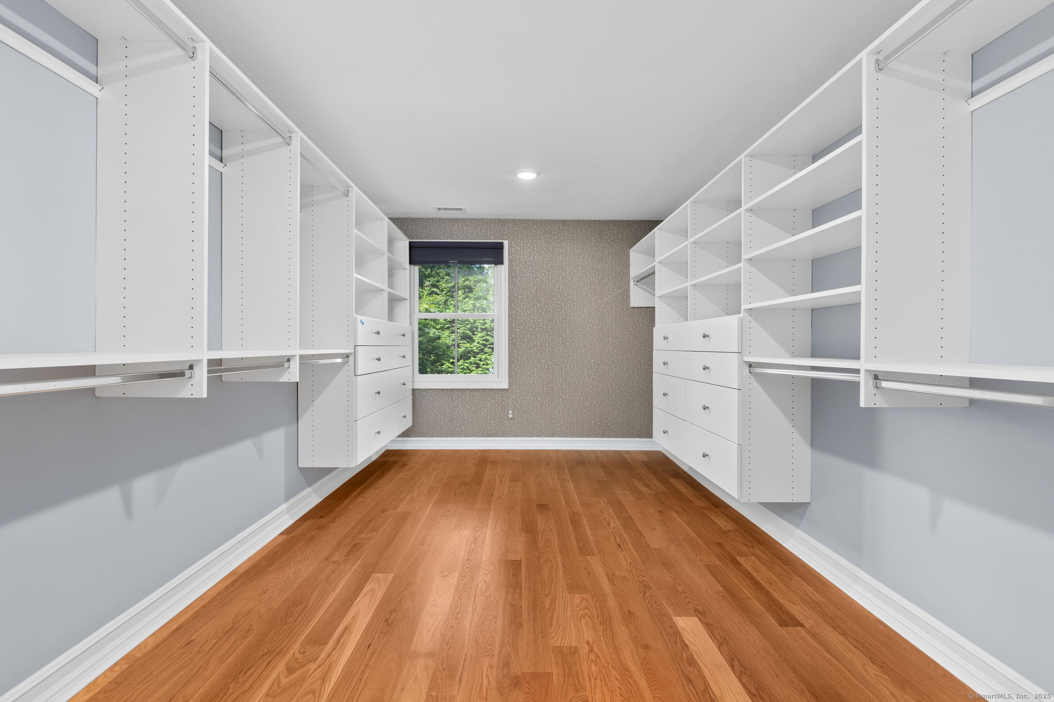 84 Olmstead Lane Ridgefield, CT 06877 - Photo 22 of 39 a view of an empty room with a window and wooden floor