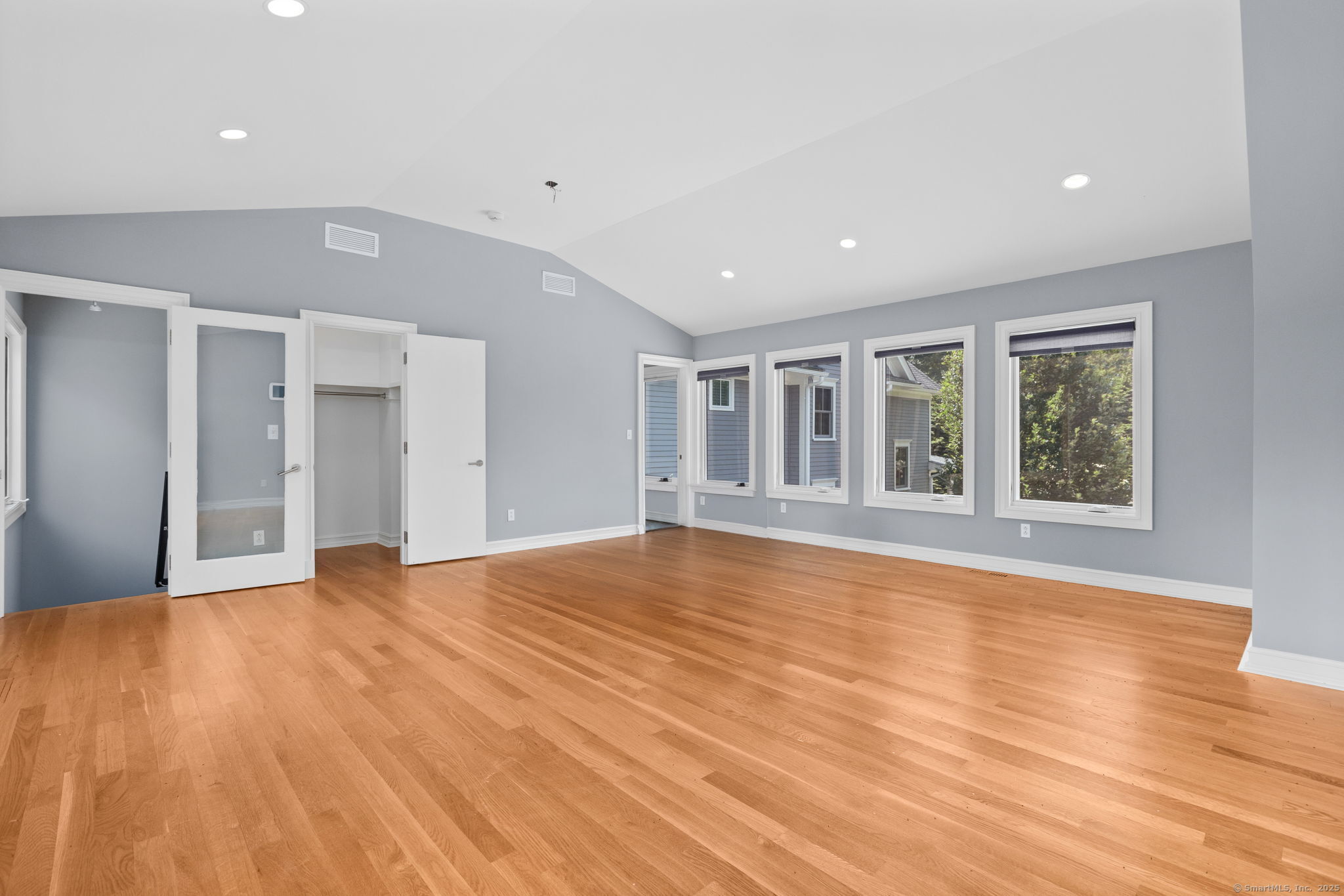 84 Olmstead Lane Ridgefield, CT 06877 - Photo 23 of 39 a view of an empty room with wooden floor and a window