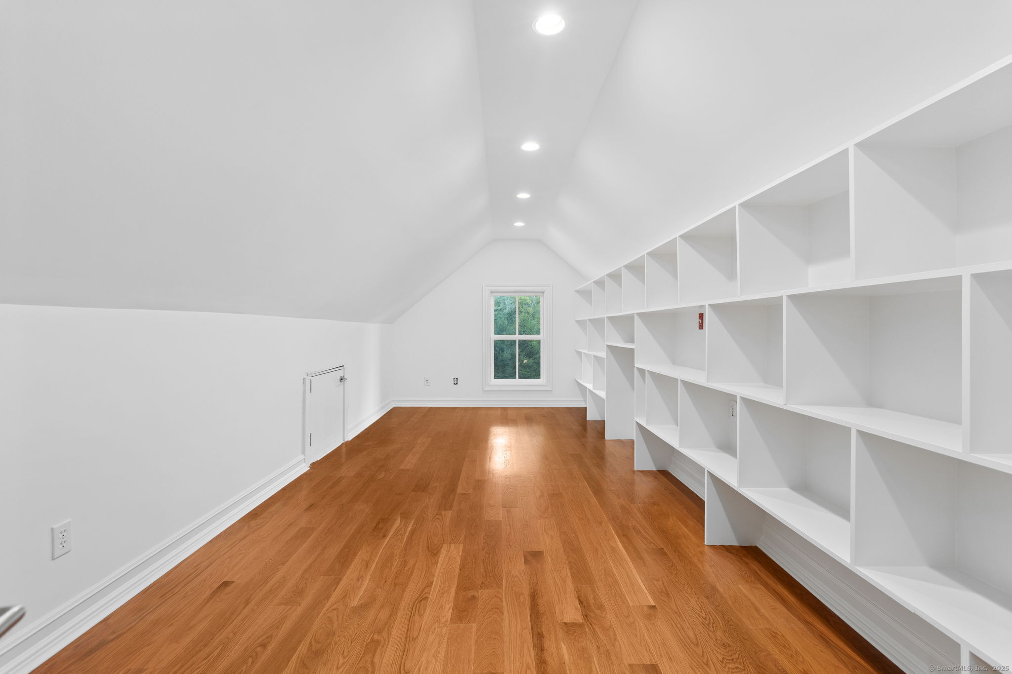 84 Olmstead Lane Ridgefield, CT 06877 - Photo 28 of 39 a view of an empty room with wooden floor and closet