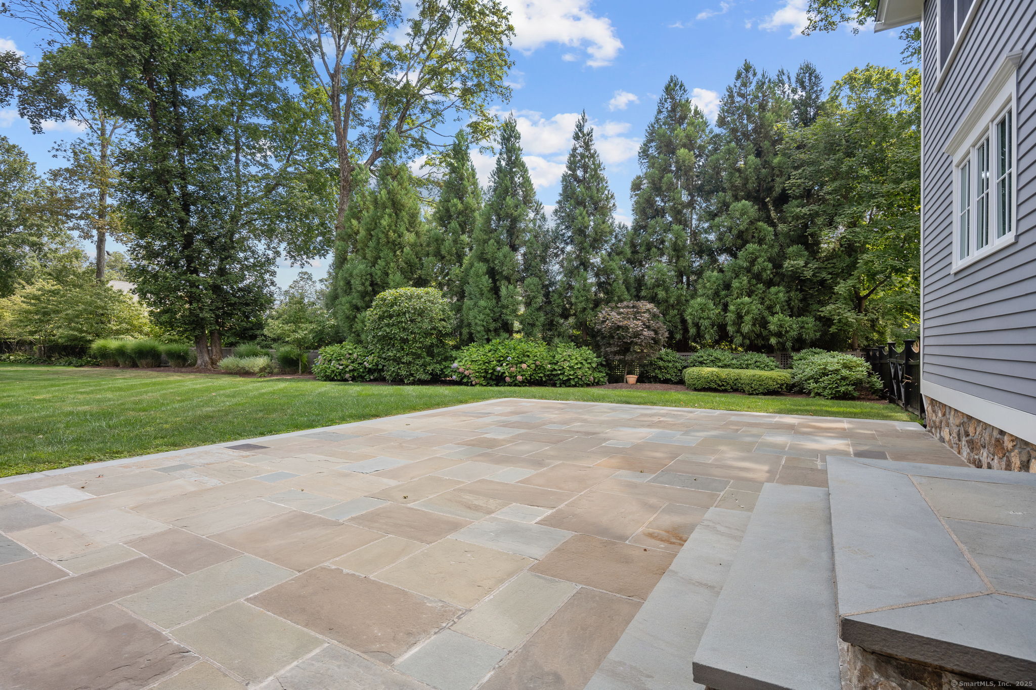 84 Olmstead Lane Ridgefield, CT 06877 - Photo 31 of 39 a view of a yard with a house