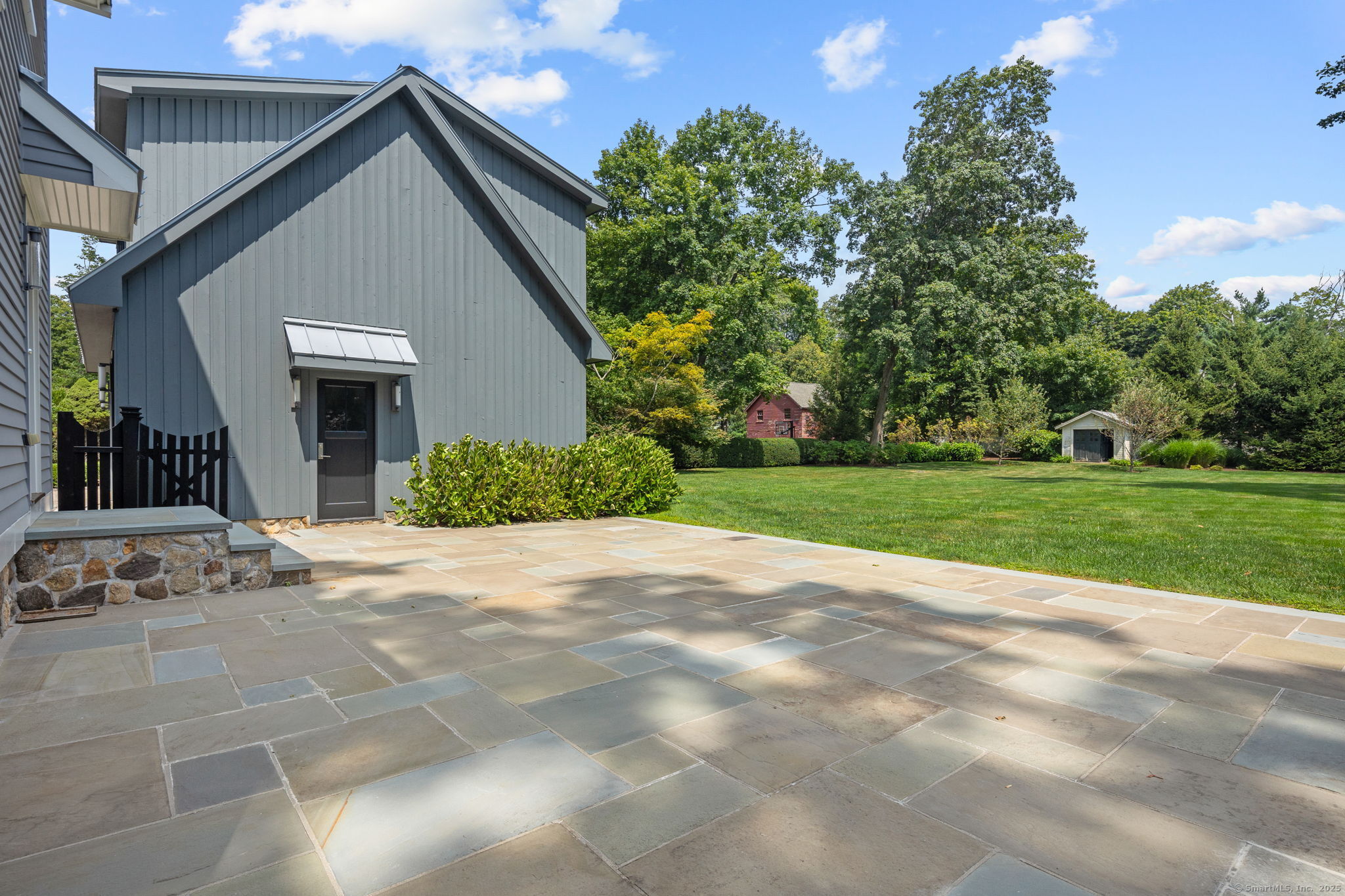 84 Olmstead Lane Ridgefield, CT 06877 - Photo 32 of 39 a view of a house with backyard and garden