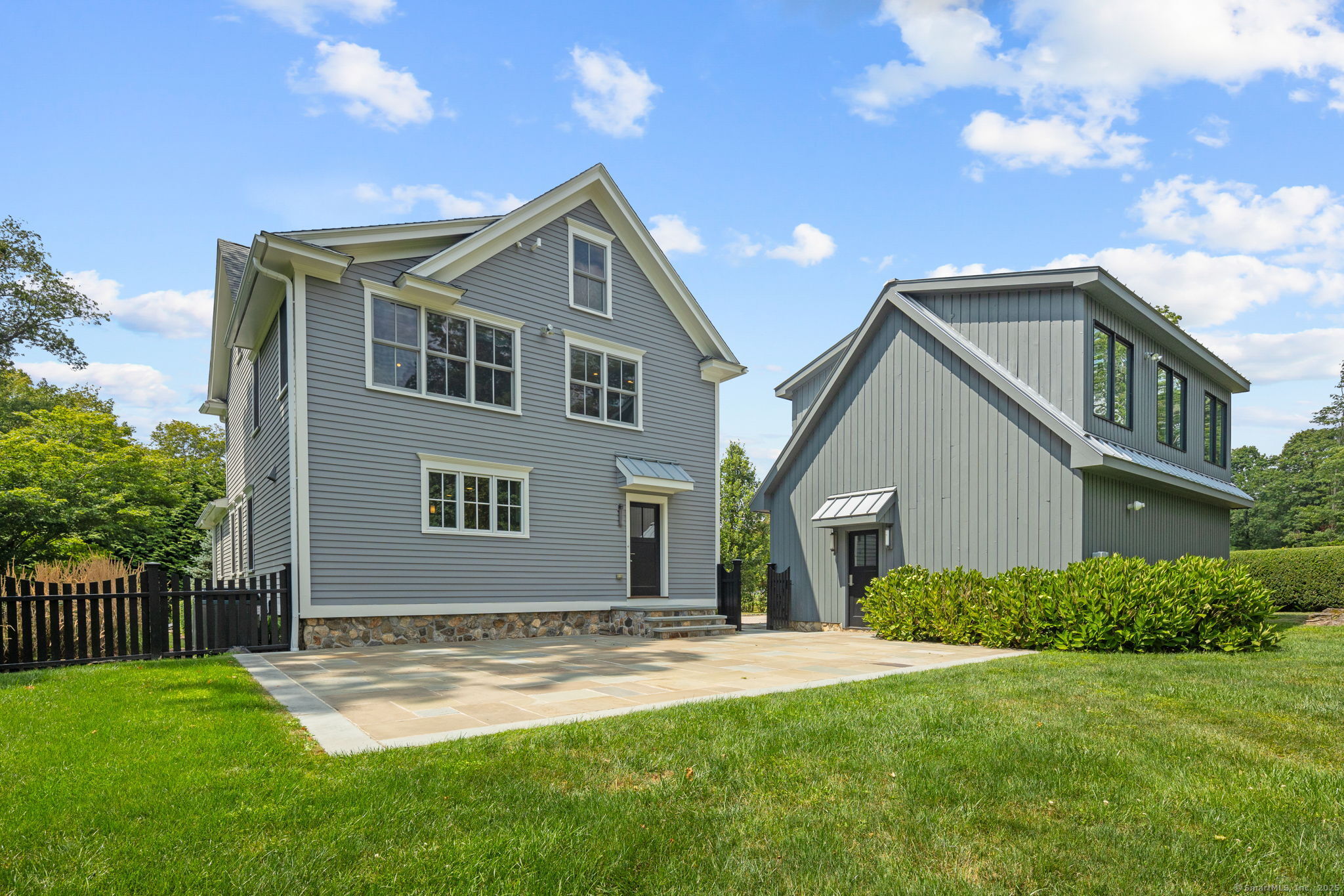 84 Olmstead Lane Ridgefield, CT 06877 - Photo 33 of 39 a front view of a house with a yard