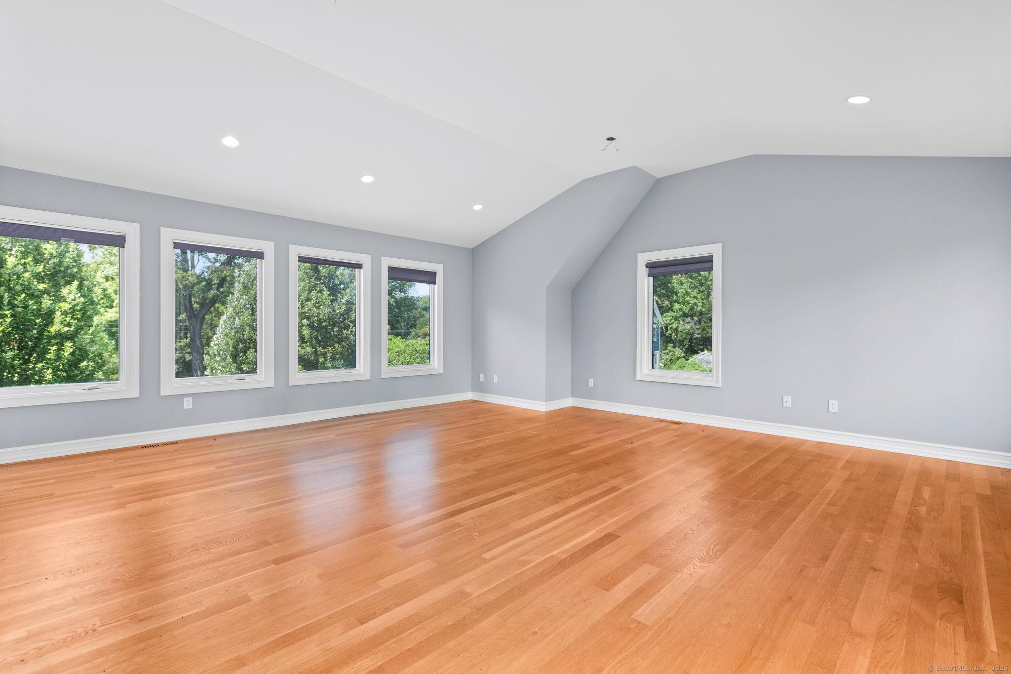 84 Olmstead Lane Ridgefield, CT 06877 - Photo 37 of 39 an empty room with wooden floor and windows