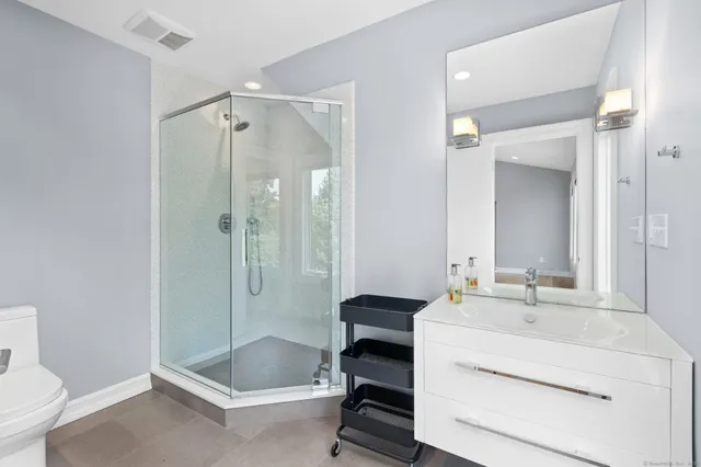 a view of a chair and table in the garden