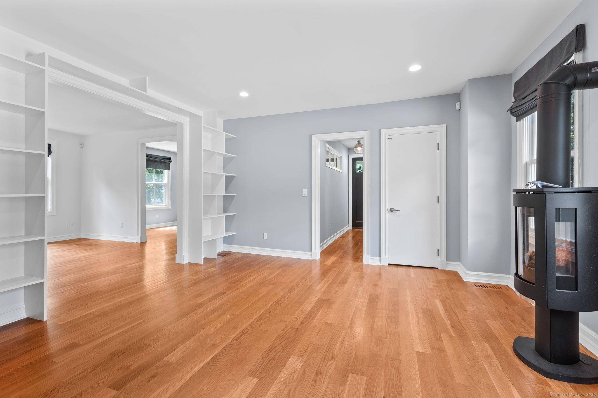 84 Olmstead Lane Ridgefield, CT 06877 - Photo 9 of 39 a view of empty room with wooden floor and fan