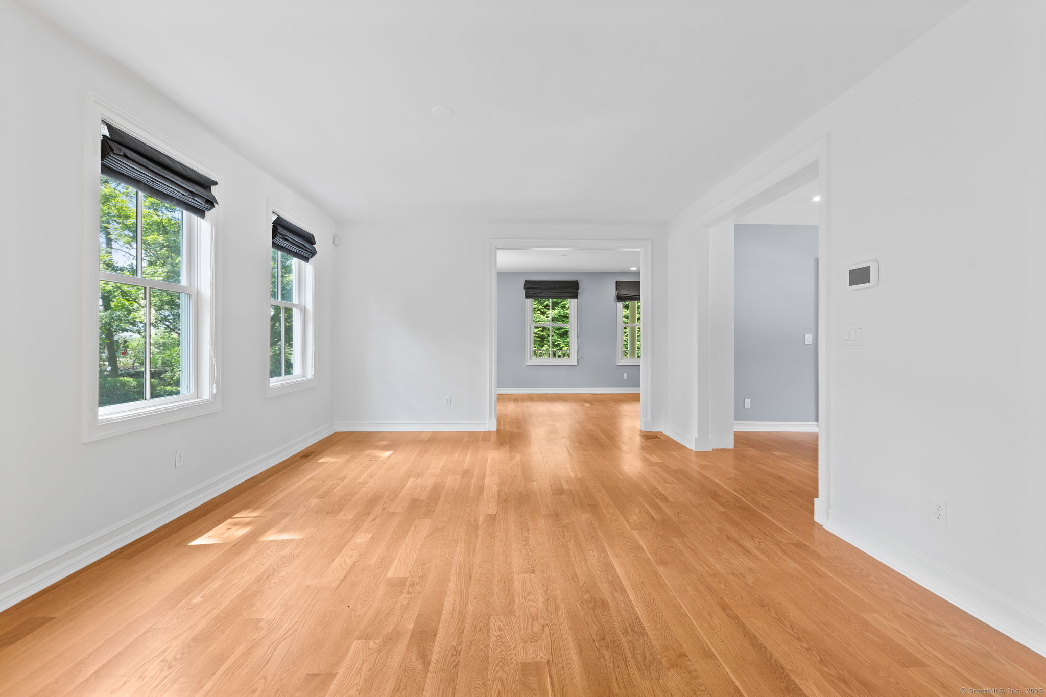 84 Olmstead Lane Ridgefield, CT 06877 - Photo 10 of 39 a view of an empty room with wooden floor and a window