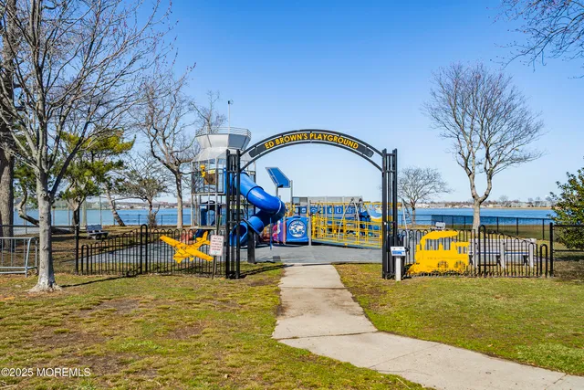 a swimming pool with outdoor seating and yard