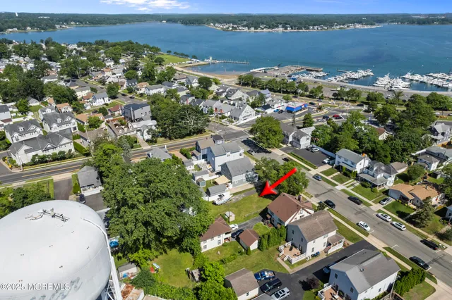 an aerial view of a house with a lake view
