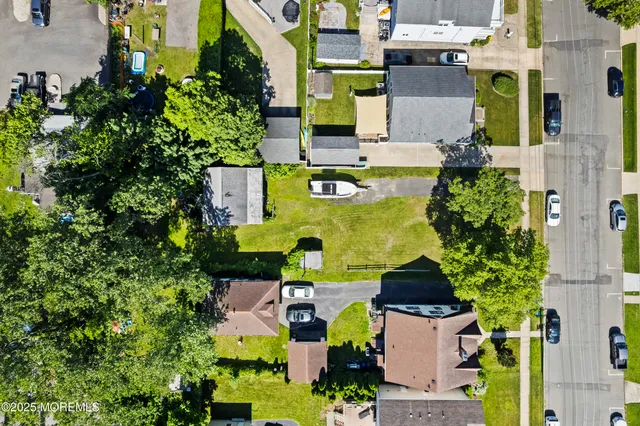 an aerial view of a house with swimming pool