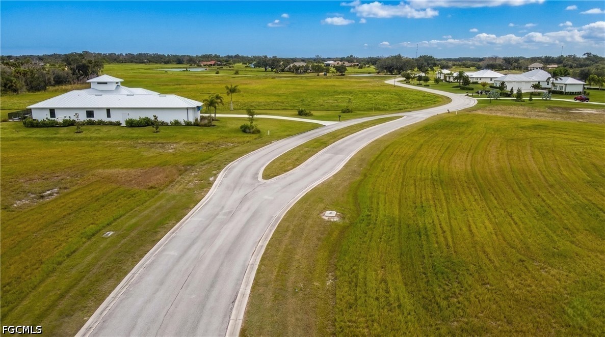 22820 Yellow Button Lane Alva, FL 33920 - Photo 4 of 6 a view of a swimming pool with an ocean view