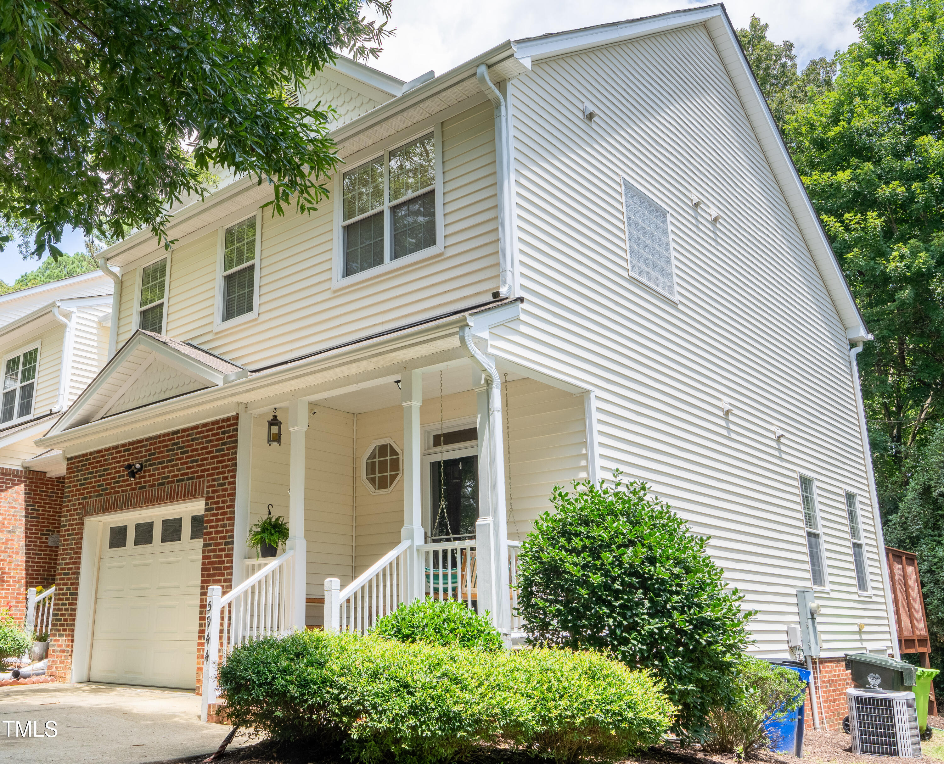 5944 Kohler Lane Raleigh, NC 27616 - Photo 1 of 26 a view of a white house with a large windows and flower plants