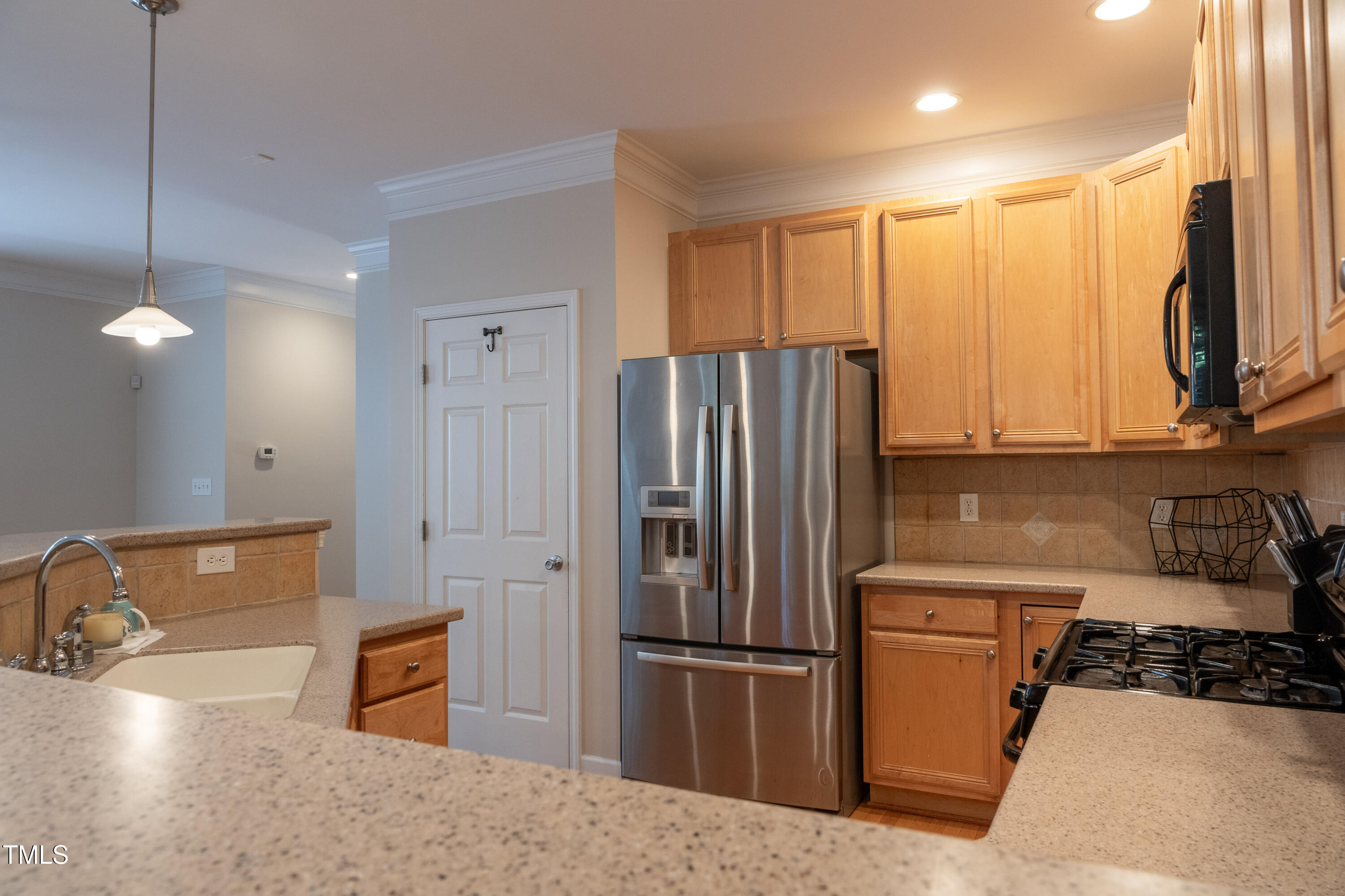 5944 Kohler Lane Raleigh, NC 27616 - Photo 11 of 26 a kitchen with stainless steel appliances granite countertop a refrigerator a sink a stove with white cabinets