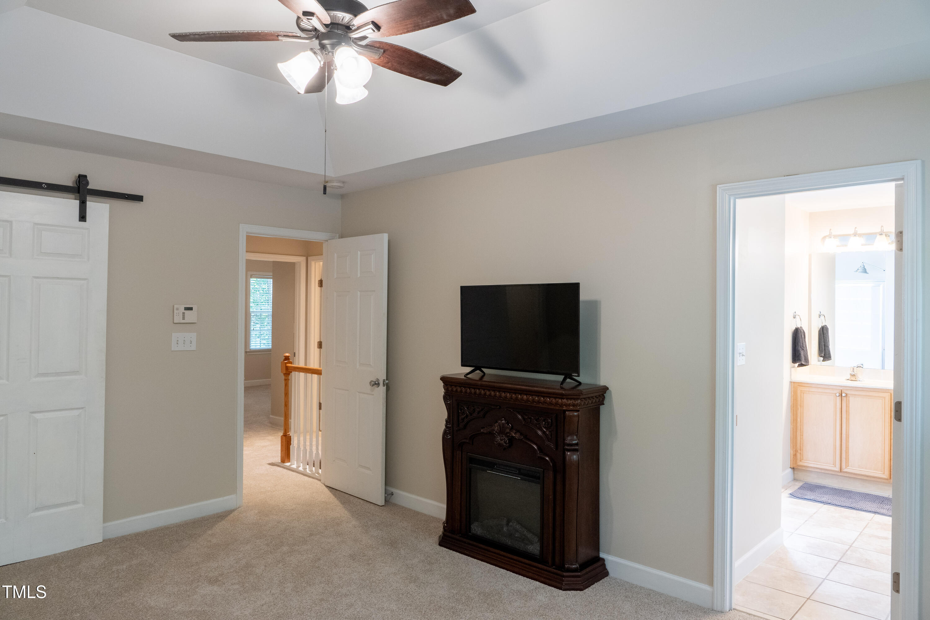 5944 Kohler Lane Raleigh, NC 27616 - Photo 14 of 26 a view of a livingroom with a flat screen tv